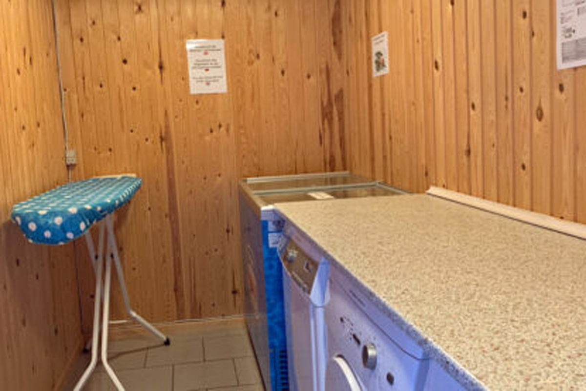 Laundry room - washing machine, dryer, ironing board